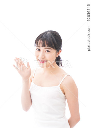 Smiling young woman doing a duty at home Smiling young woman doing a duty at home 62036346