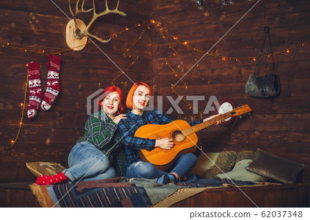 Mother with cute son sitting at home Mother with cute son sitting at home 62037348