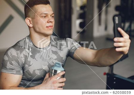 A handsome man is engaged in a gym 62038039