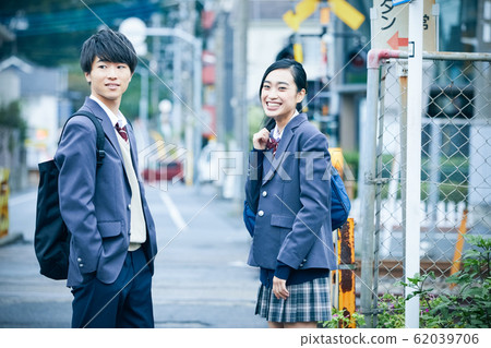 High school couple going to and from school 62039706