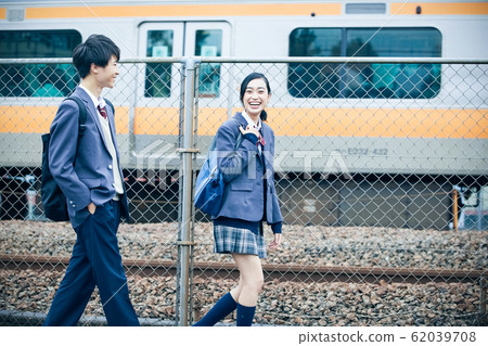 High school couple going to and from school 62039708