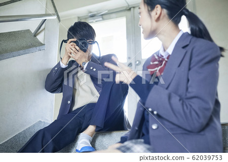 High school couple taking pictures 62039753