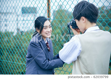 High school couple taking pictures 62039799