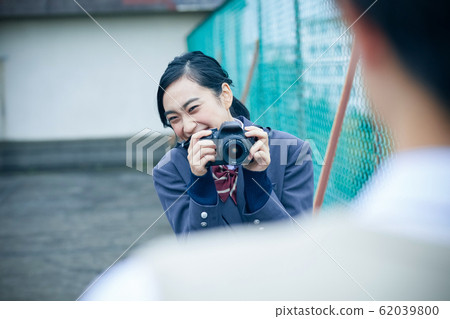High school couple taking pictures 62039800