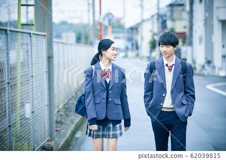 High school couple going to and from school 62039815