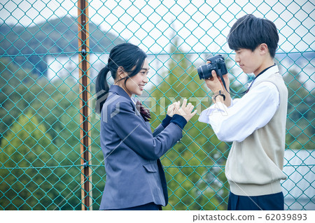 High school couple taking pictures 62039893