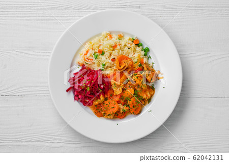 Top view of plate with beef goulash and rice 62042131