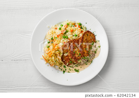 Top view of plate with liver cutlet, rice with Top view of plate with liver cutlet, rice with 62042134