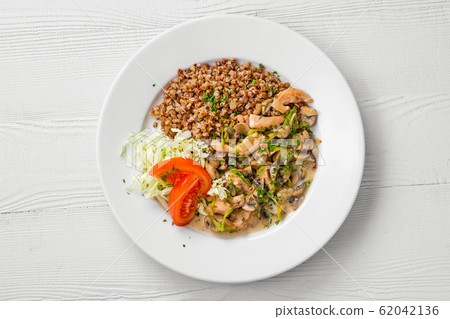 Top view of plate with chicken goulash, mushroom 62042136