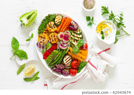 Grilled vegetables on a white plate, top view Grilled vegetables on a white plate, top view 62043674