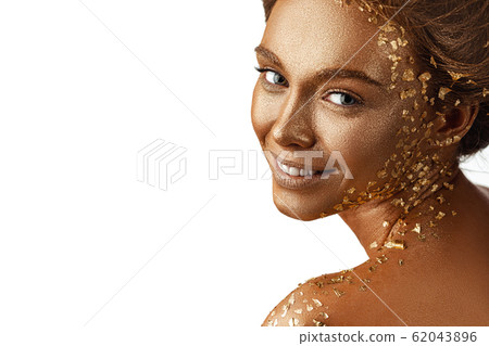 model girl with holiday golden shiny professional makeup. model girl with holiday golden shiny professional makeup. 62043896