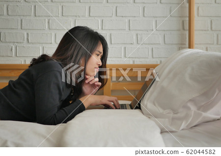 unhappy surprised upset woman working with laptop unhappy surprised upset woman working with laptop 62044582
