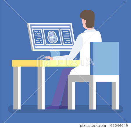Medical Worker Examining Brain Xray on Computer 62044649