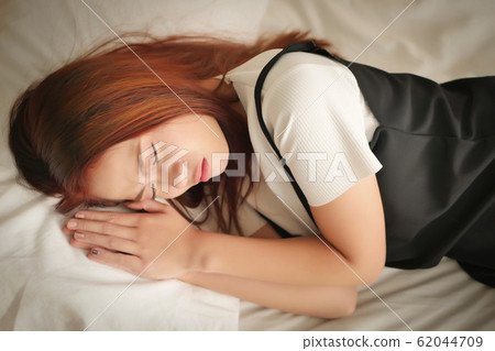 tired exhausted restless woman suffering a 62044709