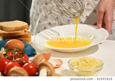 Beaten Eggs to Prepare An Omelette Beaten Eggs to Prepare An Omelette 62045828