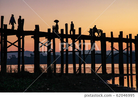Silhouette of U Bein Bridge at sunrise near Silhouette of U Bein Bridge at sunrise near 62046995