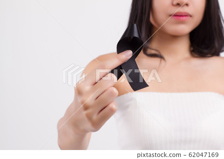 woman hand holding black ribbon bow, sad unhappy 62047169