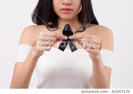 woman hand holding black ribbon bow, sad unhappy 62047170