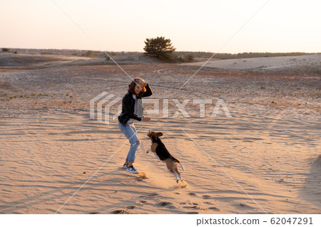 a young Caucasian girl somewhere in a leather 62047291