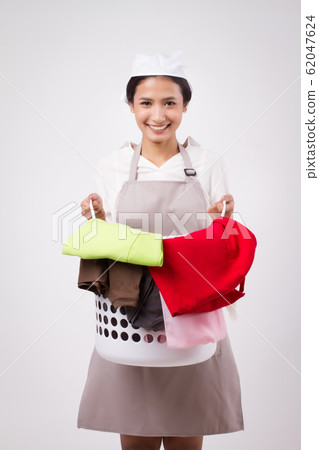 happy smiling asian woman carrying laundry basket; 62047624
