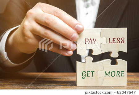 Businessman collects wooden puzzles with words Pay less get more. Offer discounts. Savings when buying. Big sale. The concept of business and finance. Profitable proposition. Attracting buyers Businessman collects wooden puzzles with words Pay less get more. Offer discounts. Savings when buying. Big sale. The concept of business and finance. Profitable proposition. Attracting buyers 62047647