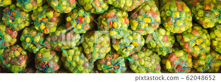 Sacks of fresh bell pepper. Eco-friendly products. Agriculture and farming. Harvest. Harvesting. Freshly harvested. Selective focus Sacks of fresh bell pepper. Eco-friendly products. Agriculture and farming. Harvest. Harvesting. Freshly harvested. Selective focus 62048652
