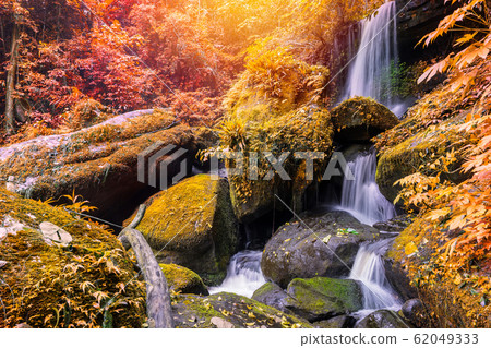 Waterfall scene at Rom Klao Pharadon Waterfalls in rainforest Thailand. Waterfall scene at Rom Klao Pharadon Waterfalls in rainforest Thailand. 62049333