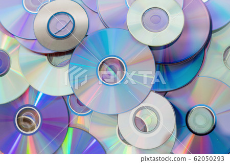 Old technology, waste compact disc collection decoration for pattern. cd background concept. Old technology, waste compact disc collection decoration for pattern. cd background concept. 62050293