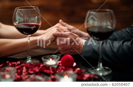 A couple having a romantic dinner in a elegance restaurant with beautiful decoration. Romance and Valentines day concept.  62050407