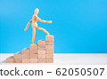 Wooden man walk up the career stairs. 62050507