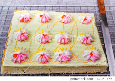 Cake with colorful cream and jam. 62050566