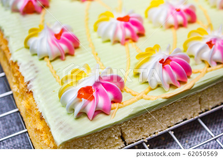 Cake with colorful cream and jam. 62050569
