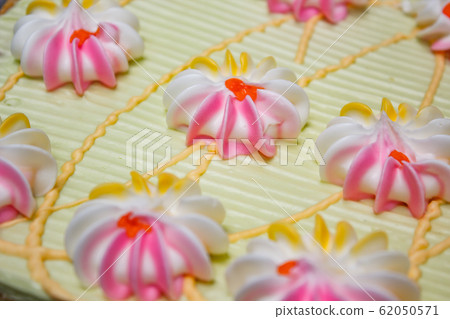 Cake with colorful cream and jam. Cake with colorful cream and jam. 62050571