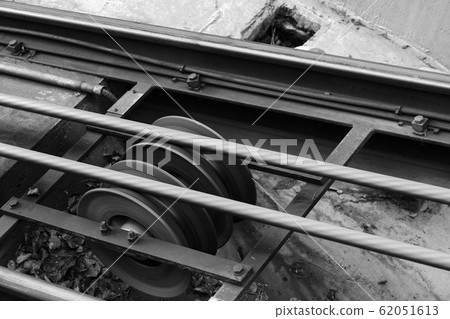 Funicular details. Rails, moving traction cable Funicular details. Rails, moving traction cable 62051613