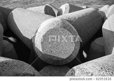 Gray concrete breakwater blocks close up Gray concrete breakwater blocks close up 62051616