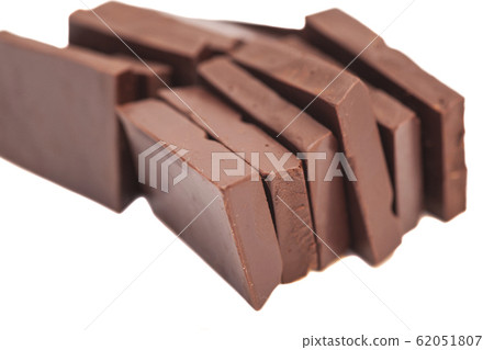 Broken milk chocolate bar isolated on white 62051807