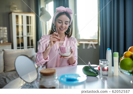 Young pretty girl in a pink headband having a beauty day 62052587