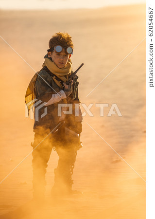 Post Apocalyptic Boy Outdoors in a Wasteland Post Apocalyptic Boy Outdoors in a Wasteland 62054667
