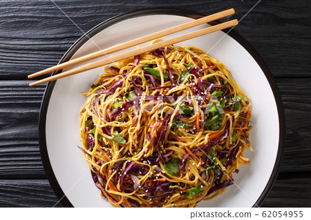 Tasty egg noodles with vegetables and sesame seeds Tasty egg noodles with vegetables and sesame seeds 62054955