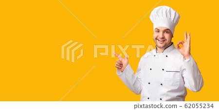 Chef Gesturing Okay Pointing Finger At Copy Space, Yellow Background 62055234