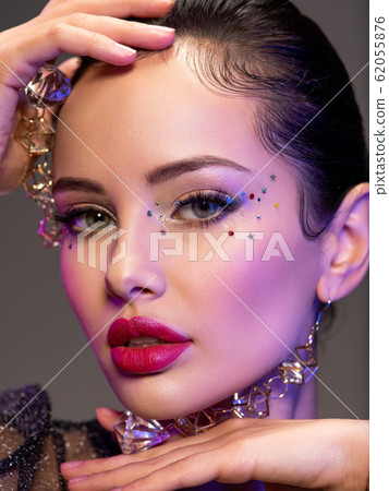 Portrait of beautiful young woman with bright Portrait of beautiful young woman with bright 62055876