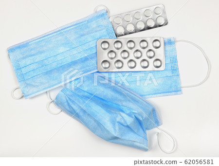 Blue medical mask and pills Blue medical mask and pills 62056581