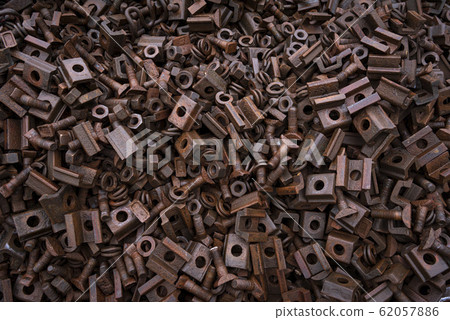 Metal pieces in a pile collected for recycling. 62057886