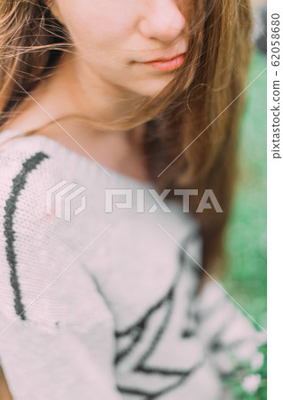 beautiful woman with flowers walking through the green forest in early spring beautiful woman with flowers walking through the green forest in early spring 62058680