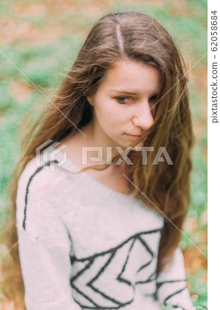 beautiful woman with flowers walking through the green forest in early spring beautiful woman with flowers walking through the green forest in early spring 62058684