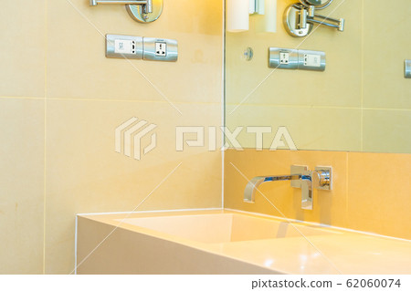 White sink with water faucet decoration in bathroom White sink with water faucet decoration in bathroom 62060074