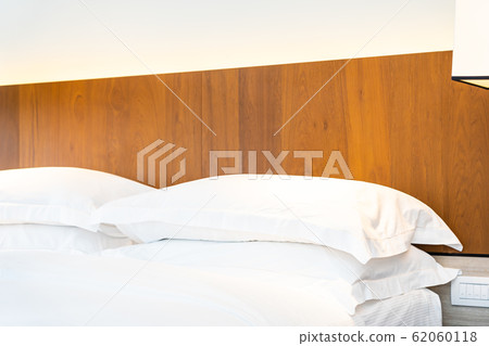 White comfortable pillow on bed decoration 62060118