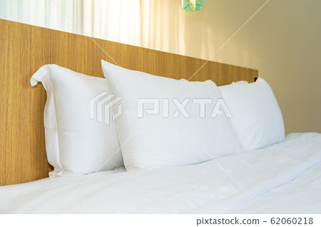 White pillow on bed decoration interior White pillow on bed decoration interior 62060218