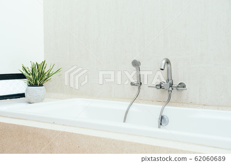 Beautiful luxury white bathtub decoration interior of bathroom Beautiful luxury white bathtub decoration interior of bathroom 62060689
