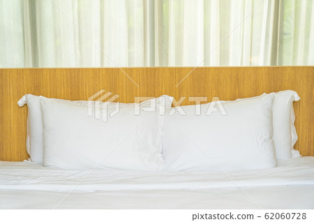 White pillow on bed decoration interior White pillow on bed decoration interior 62060728
